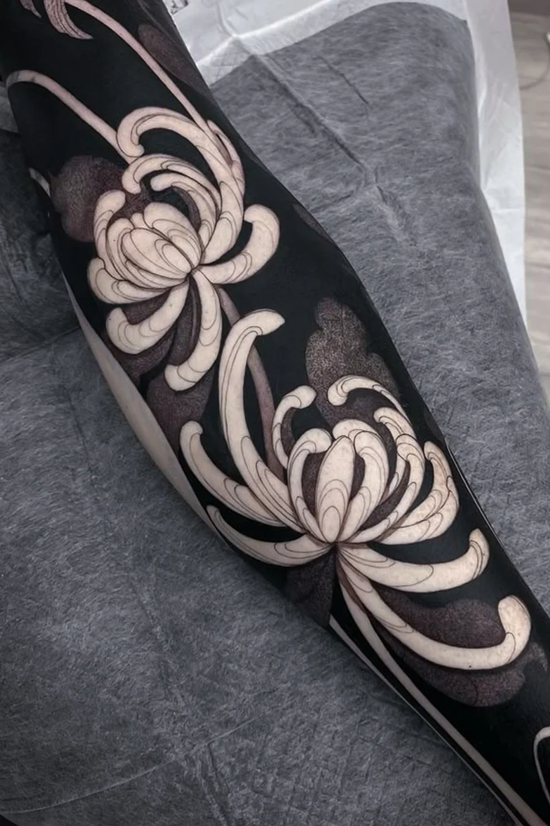 a hand with an elegant blackout tattooo