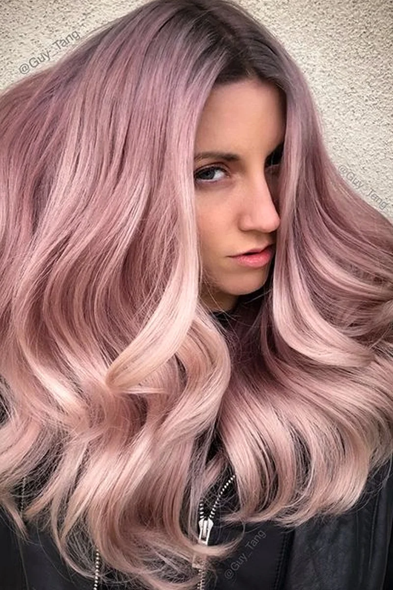 a portrait of a beautiful woman with a dusty pinke hair
